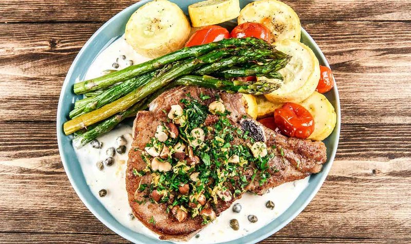 Bone-In Pork Chop with Hazelnut Gremolata